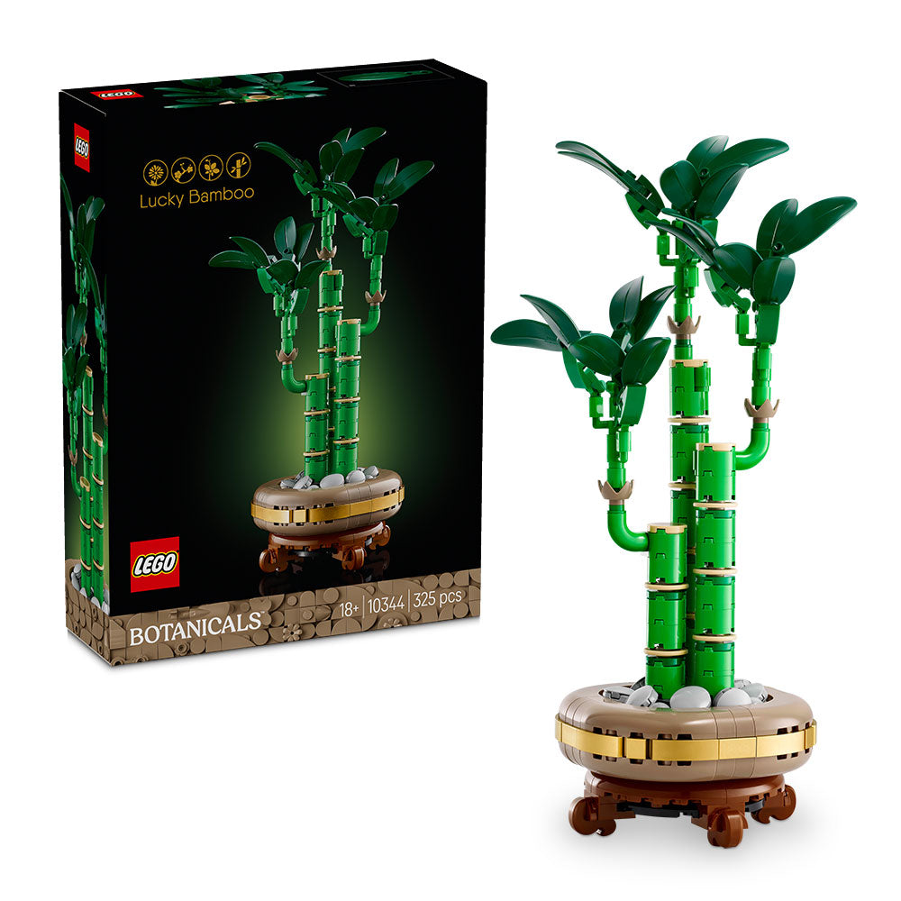 Planta LEGO de bambú de la suerte con tres tallos verdes, maceta con guijarros y base efecto madera